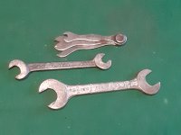 A COLLECTION OF TOOLKIT SPANNERS 1944 DATED